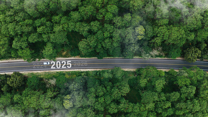 Aerial top view road in forest with car to start the new year 2025 Goal plan action, Business...