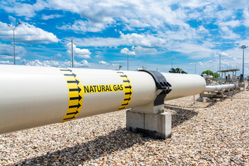 Gas pipeline at the compressor station site with the designation of the transported medium and the...
