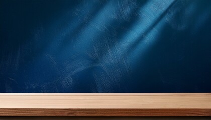Empty table on dark blue texture wall background. Composition with organic shadow on the wall and...