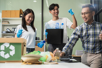 Business people working examining waste recyclable separation divided bin in the office, Sustainable development and innovation green business concept.