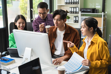 Group of Young Asian business team creative businesspeople coworker in office Happy to be successful partnership teamwork success concept.