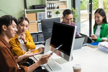 Group of Young Asian business team creative businesspeople coworker in office Happy to be successful partnership teamwork success concept.