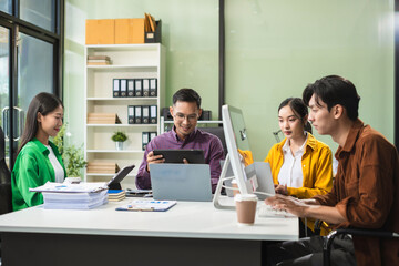 Group of Young Asian business team creative businesspeople coworker in office Happy to be successful partnership teamwork success concept.