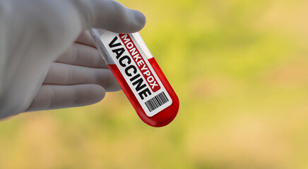 Mpox monkeypox virus vaccine. Doctor in white gloves in holding a cure for the Mpox monkeypox...