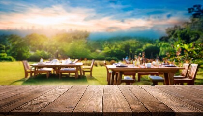 Obraz premium Empty wooden table with party in garden background blurred. and beautiful natural scenery view 