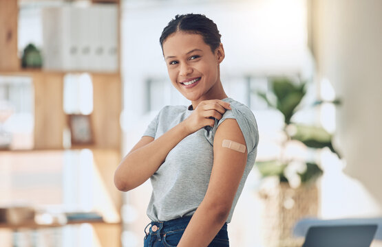 Happy woman, portrait and vaccine with plaster for healthcare, cure or recovery at home. Young female person with smile or bandaid on arm for vaccination, protection or medical injection at house
