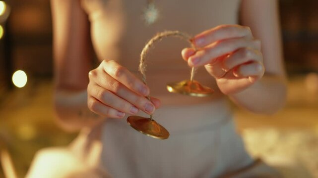Girl Holds Tibetan Bells in her hands