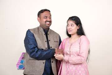 Sister tying Rakhi on her brother's wrist as they celebrate Raksha Bandhan, sharing moments of love and fun on this special day.