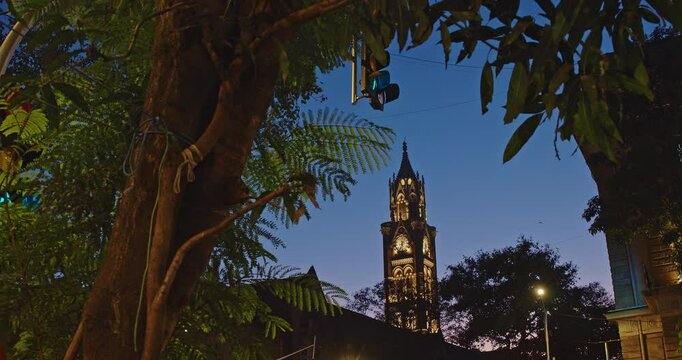 Rajabai Clock Tower In Evening Illumination. Clock Tower In Mumbai India. Confines Of Fort Campus Of University Of Mumbai. Modeled It On Big Ben In London. It Stands At Height Of 85 M or 280 Ft