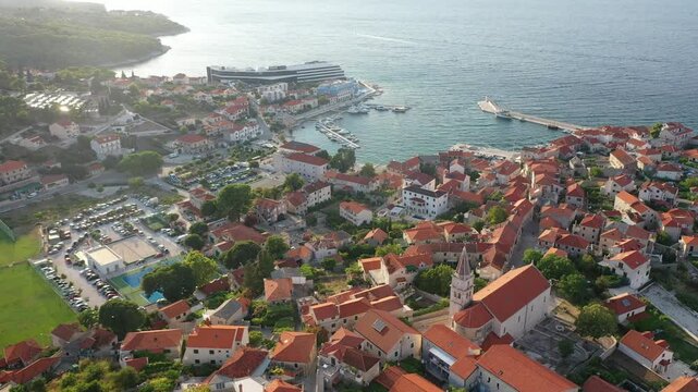 Aerial Drone View of Postira on Brac Island with Emphasis on Stunning Coastal Scenery and Charming Mediterranean Village Life