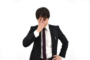 悩んでいるスーツの男性2　白背景