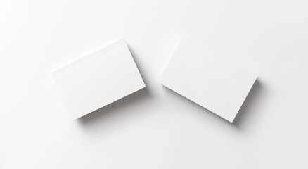 A mockup of white two business cards, top view and isolated, with 3D rendering. A mockup of the front and back of the namecard. A template for creating a call sheet for including the company name,