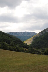 Fototapeta premium landscape in the summer with mountains and clouds