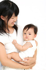 赤ちゃんを抱き向き合うお母さんの後ろ姿。育児,子育て,ライフスタイル,,育児イメージ