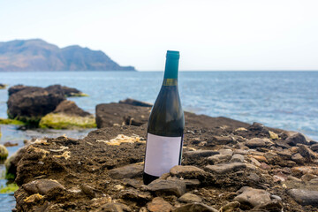 Bottle of wine by the sea