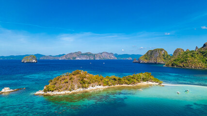 Aerail view of  tropical exotic island sand bar separating sea in two with turquoise  in El Nido, Palawan, Philippines.