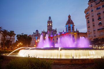 Stunning night view of colorful fountains and historic buildings