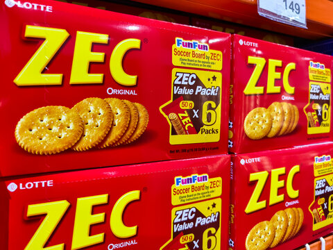 Stack of ZEC cracker boxes on supermarket shelf in bright packaging