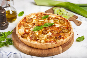 Quiche open tart pie with leek and chicken meat. Savory taste. 