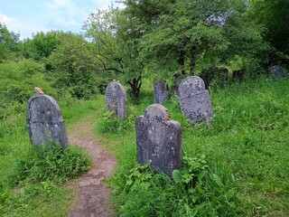 old stone graves in cemetery