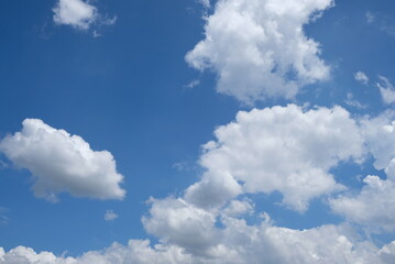 Bright sunny sky with beautiful white clouds