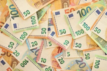 Pile of euro paper banknotes as finance background