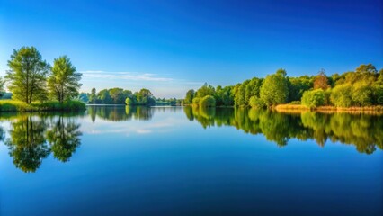 Tranquil landscape with a serene lake reflecting a clear blue sky , nature, water, reflection, peaceful, serene, scenic