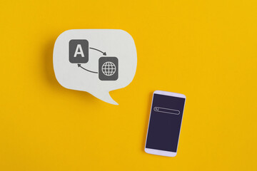 For translator application, foreign languages concept, top view of real white speech bubble paper...