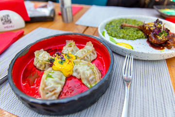 Fried Chinese gedza with mango mousse and chipotle pepper