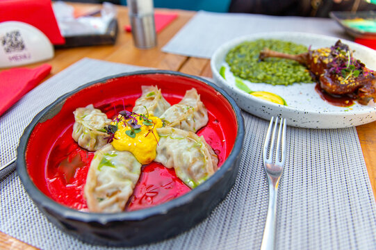 Fried Chinese gedza with mango mousse and chipotle pepper
