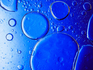 Bubbles on blue background. Abstract oxygen bubble water in sea sponge on blue background.Blue...
