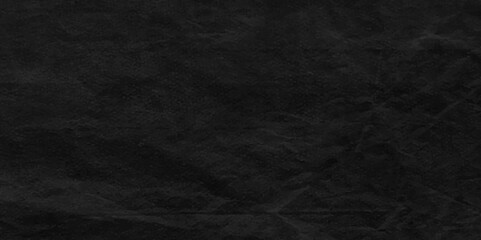 Fototapeta premium Dark black wrinkly backdrop paper background. Black paper crumpled texture background , Creative Design Templates. Print for textile, fabric, wallpaper, wrapping paper. Copy space. 