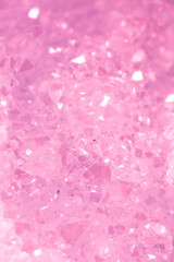 Fototapeta premium Amethyst pink crystals. Gems. Mineral crystals in the natural environment. Texture of precious and semiprecious stones. Seamless background with copy space colored shiny surface of precious stones.