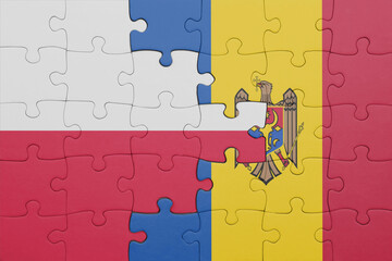 puzzle with the colourful national flag of moldova and flag of poland.