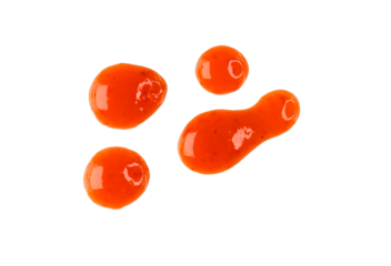 Drops of red hot chilli sauce isolated on white, top view, clipping path, PNG