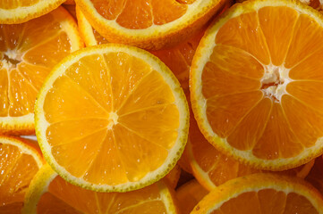 Fototapeta premium Colorful slices of fresh, juicy oranges as a background