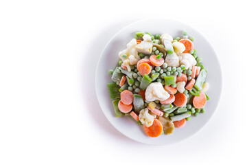 Frozen vegetable stew on a plate isolated on white background