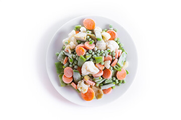 Frozen vegetable stew on a plate isolated on white background