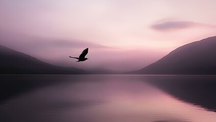 Naklejka premium Bird flying over still lake at dusk.