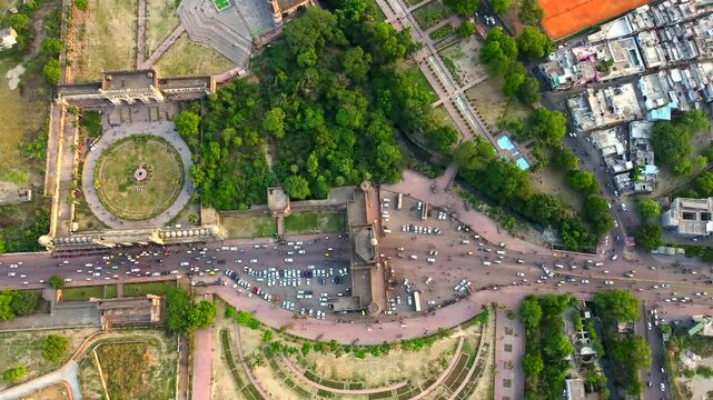  Aerial view of bada Imambara complex on city road with rumi darwaza Islamic architecture built by nawab asaf-ud-daulain 1784, lucknow, uttar pradesh, India, asia.