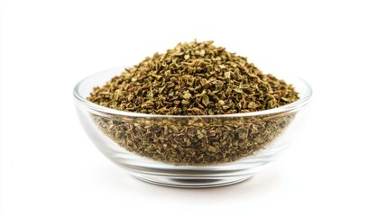 A small glass bowl of dried oregano, isolated on a white background, with the crushed herbs piled high inside the clear container.
