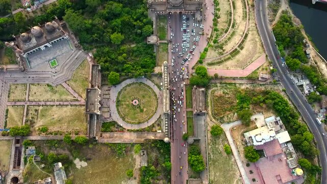  Aerial view of bada Imambara complex on city road with rumi darwaza Islamic architecture built by nawab asaf-ud-daulain 1784, lucknow, uttar pradesh, India, asia.