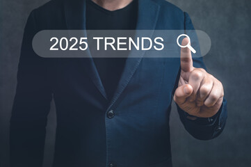 Businessman searching 2025 trends on searching bar for business marketing searching. touching to search engine bar with 2025 trends for Marketing target plan goal management