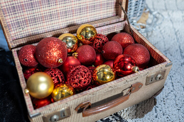 Christmas toys in an open old suitcase. Christmas background, Christmas card, Christmas wallpaper.