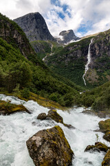 Obraz premium View of the Kleivafossen Waterfall near Briksdal Glacier in Norway.