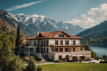 Fototapeta premium beautiful view of the villa by the lake with mountains