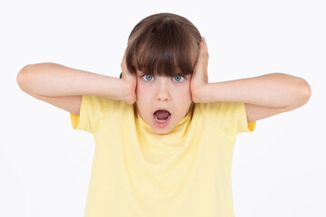 Photo of shocked afraid cute girl open mouth hands head wear yellow t-shirt isolated white background