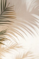 Obraz premium Elegant composition of palm leaves casting gentle shadows on a beige wall, creating a serene and tropical atmosphere.