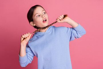 Photo of lovely small schoolkid choke braids wear hoodie isolated on pink color background