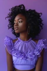 Fototapeta premium Young African American woman isolated on a solid purple background, posing confidently